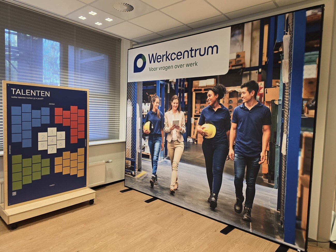 Adviseurs van het Werkcentrum Haaglanden staan klaar voor bezoekers.